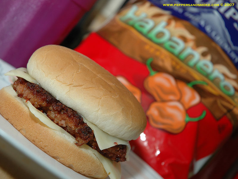 The finished 100% bacon burger on a bun with habanero chips